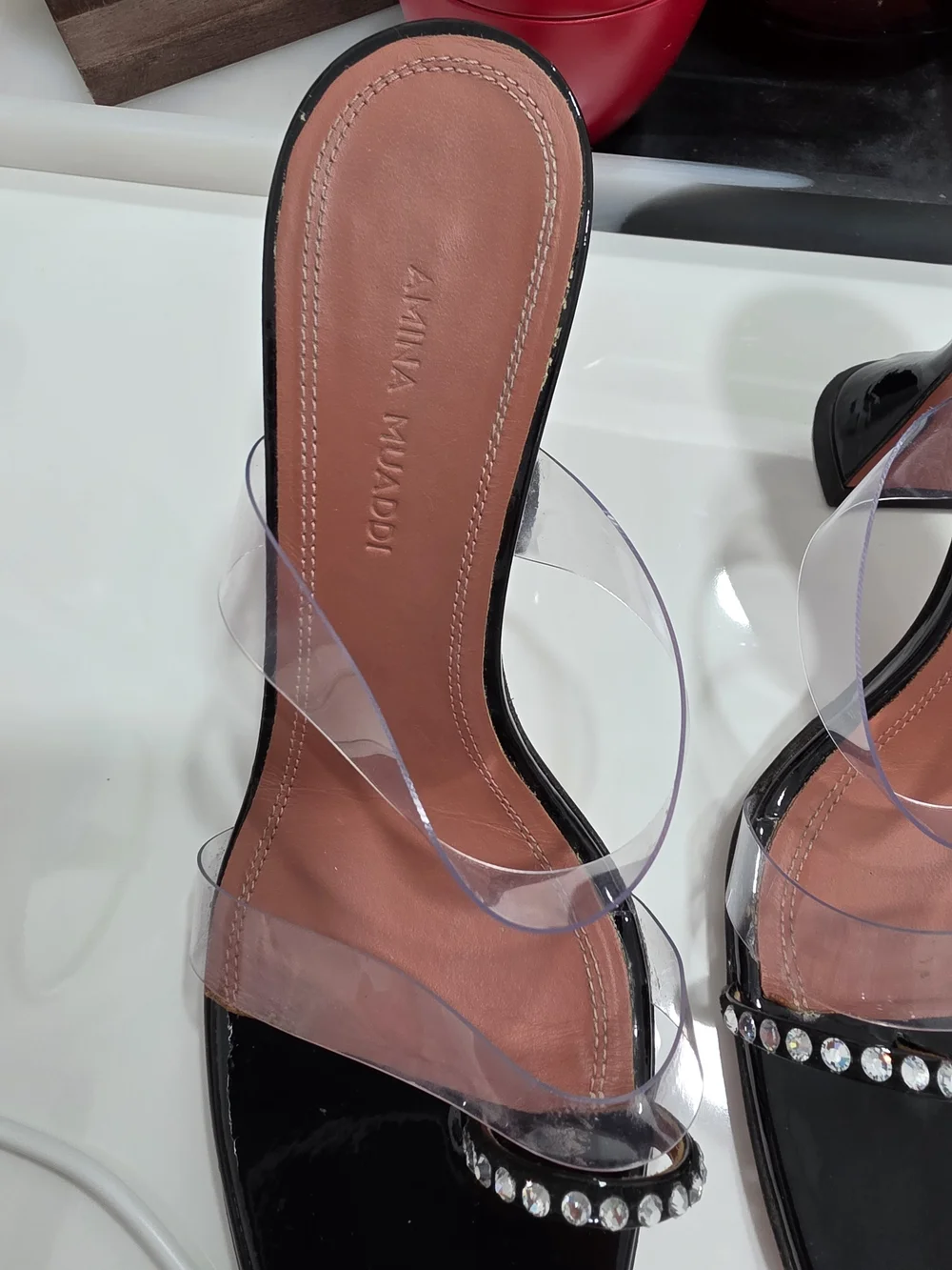 Amina Muaddi Black Patent Slide Heels with Clear Straps and Crystal Trim